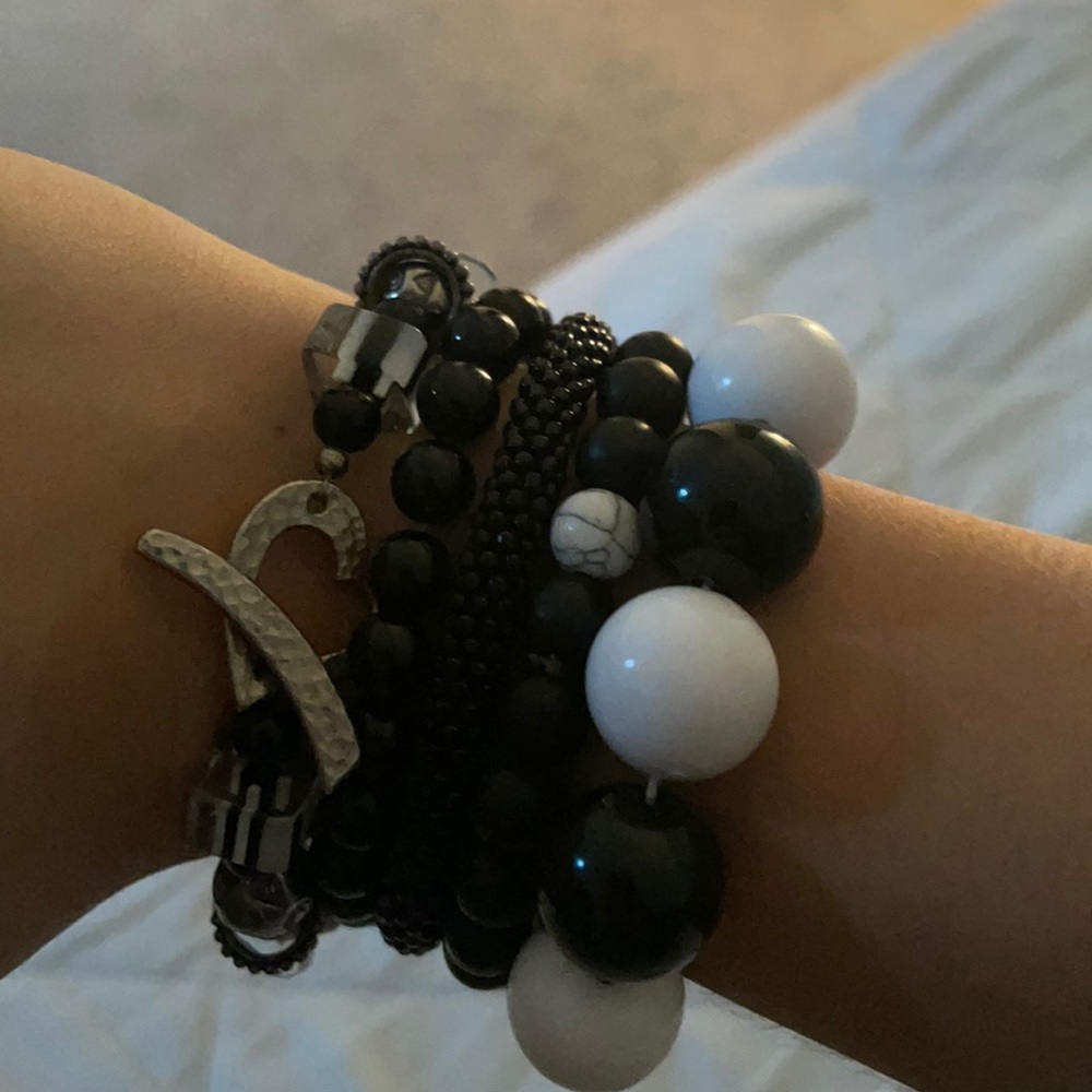 I am selling 5 black and white bracelets